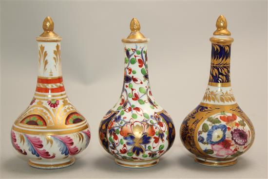 Three Derby porcelain scent bottles and stoppers, early 19th century, 10.5 - 11cm